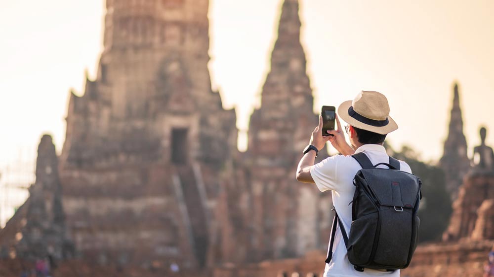 a tourist taking a photo in Thailand