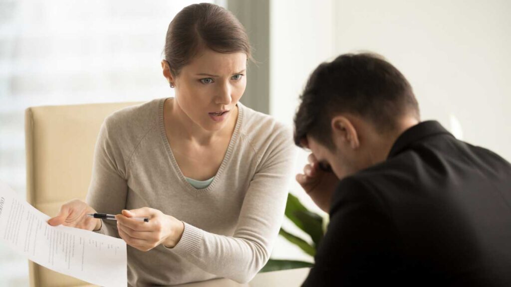 a business woman complaining to a man