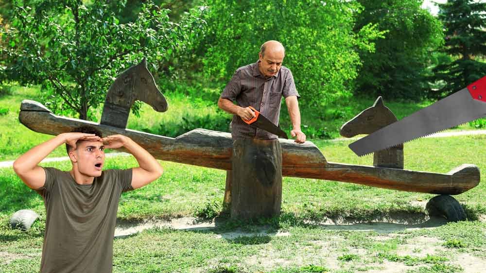 a man sawing a seesaw