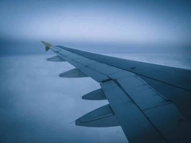 view from a plane wing flying in bad weather