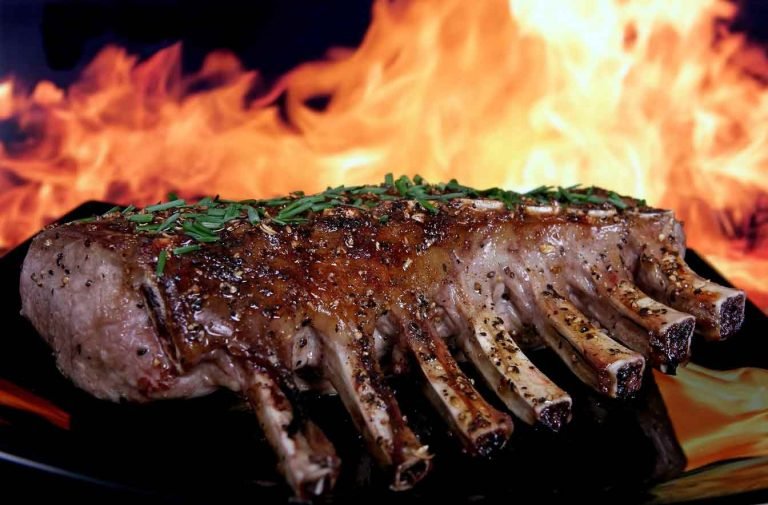 meat roasting beside a fire