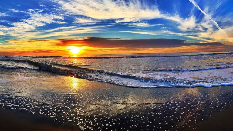 a beach at sunset