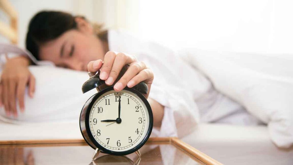 woman with morning alarm clock
