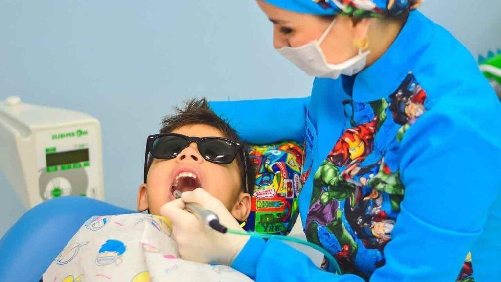 a dentist working on a kids teeth