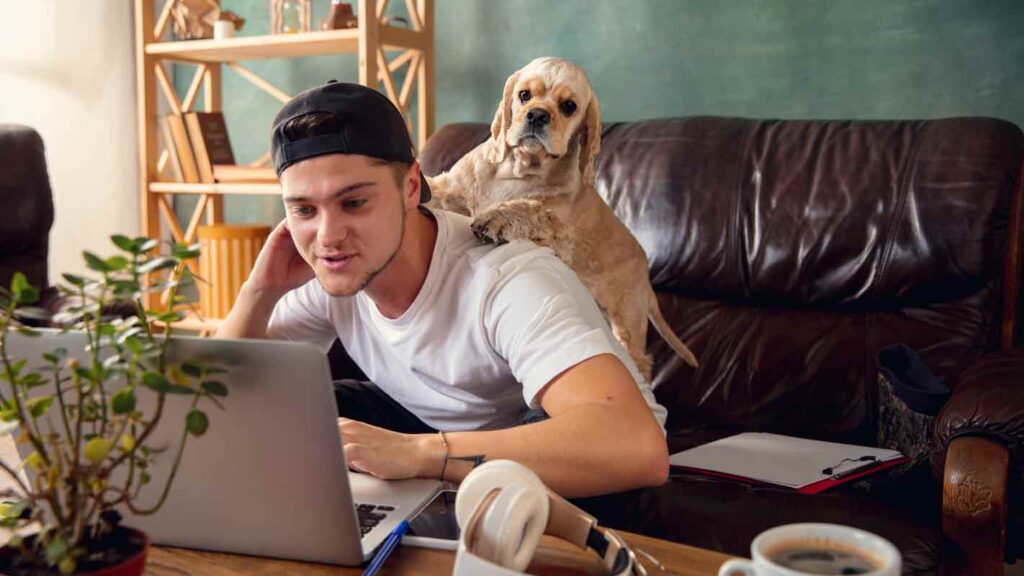 a man at home with his dog