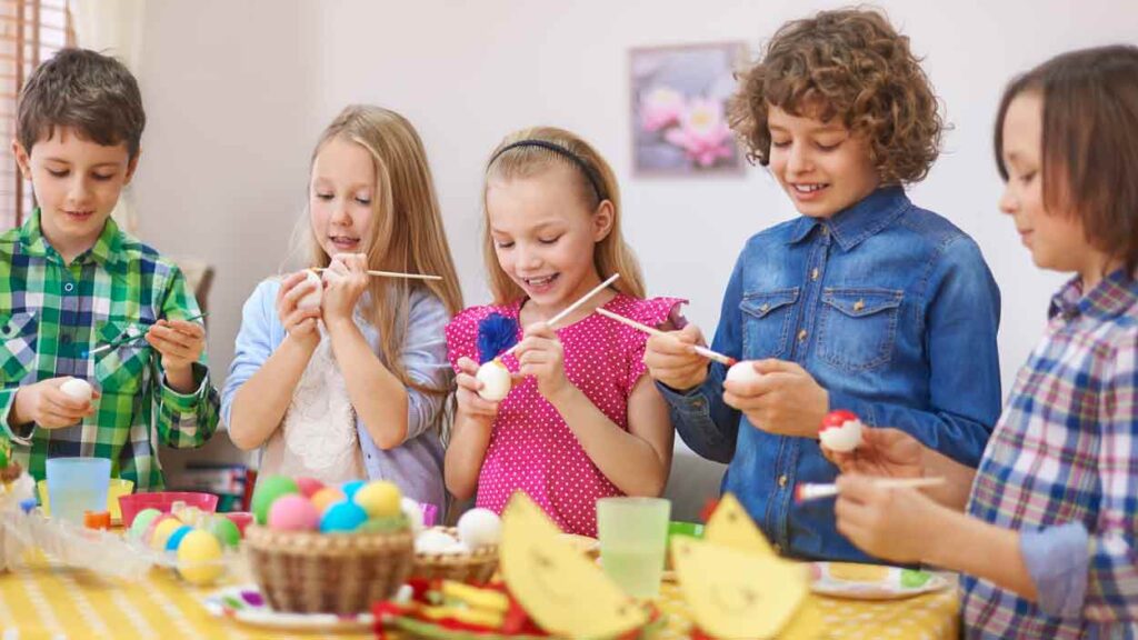 children painting Easter eggs