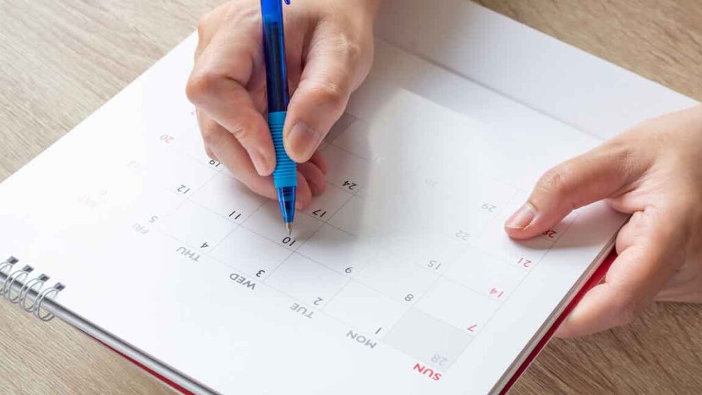 writing on a calendar to remember.