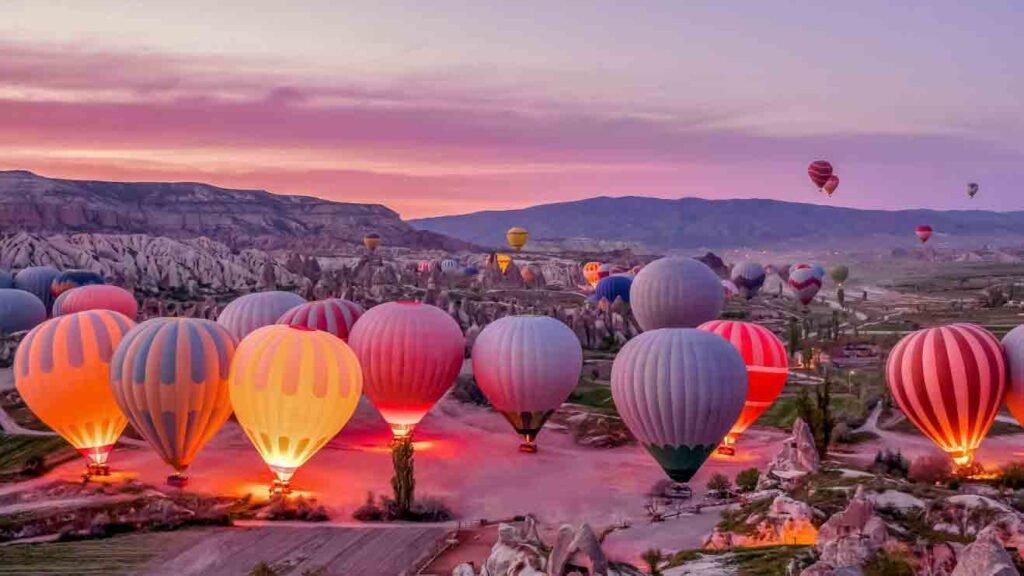 a colorful scene of hot air balloons