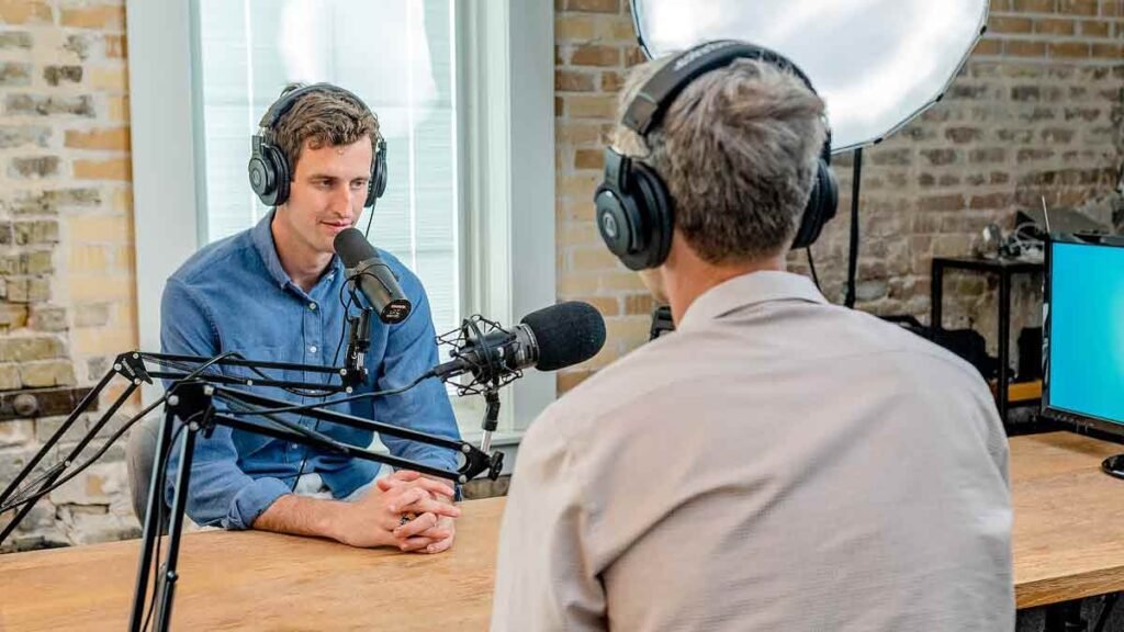 2 men broadcasting radio news