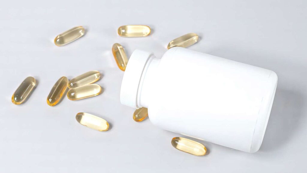 a medicine bottle with capsules