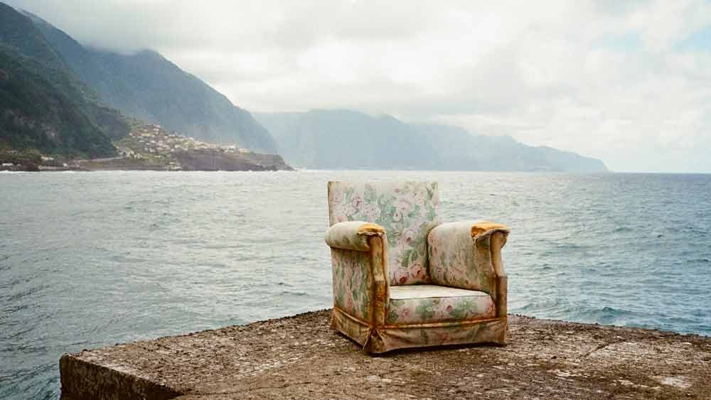 an empty armchair giving a sense of loss