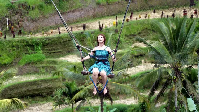 a woman having a ball on a swing - fun idioms