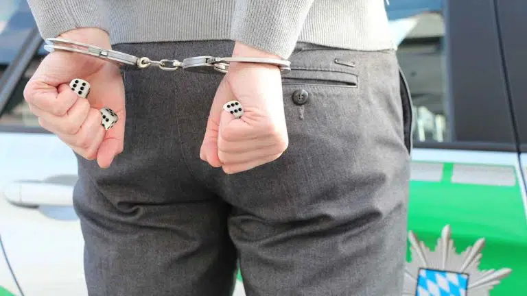 man in handcuffd - no dice idiom meaning