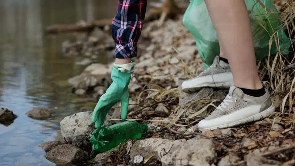 a person picking up trash