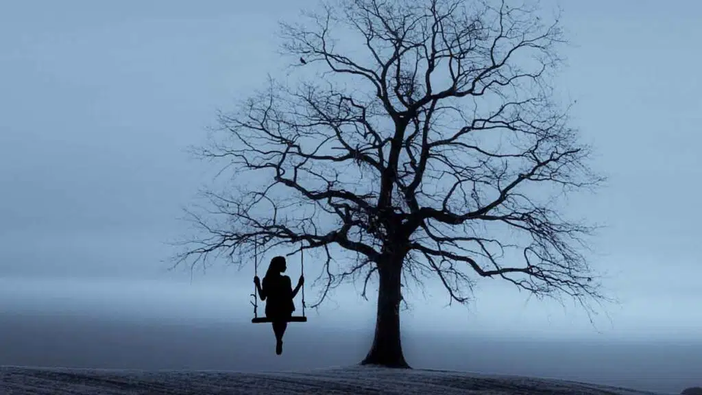 lonely woman on a swing