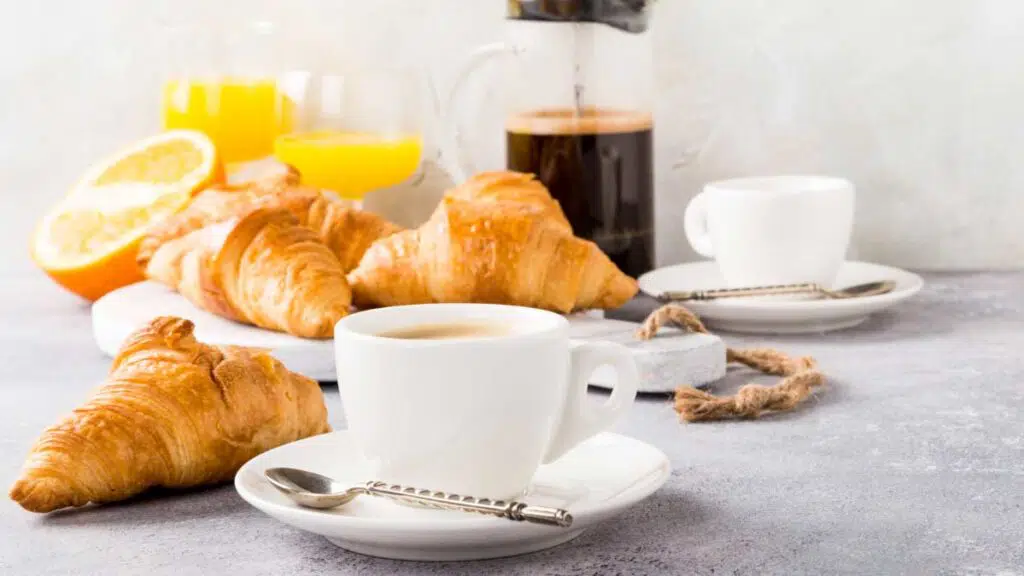 breakfast of coffee and croissants