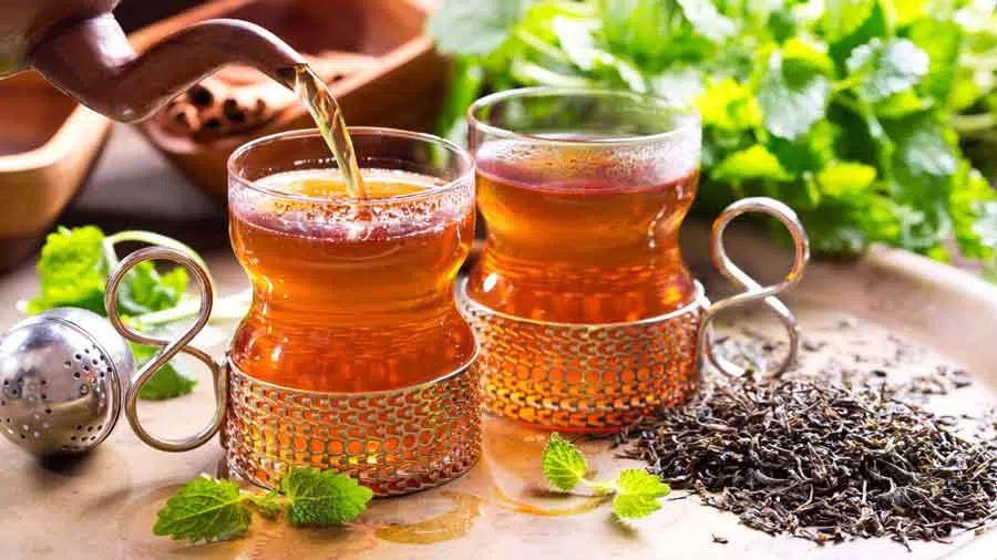 tea being poured into a glass